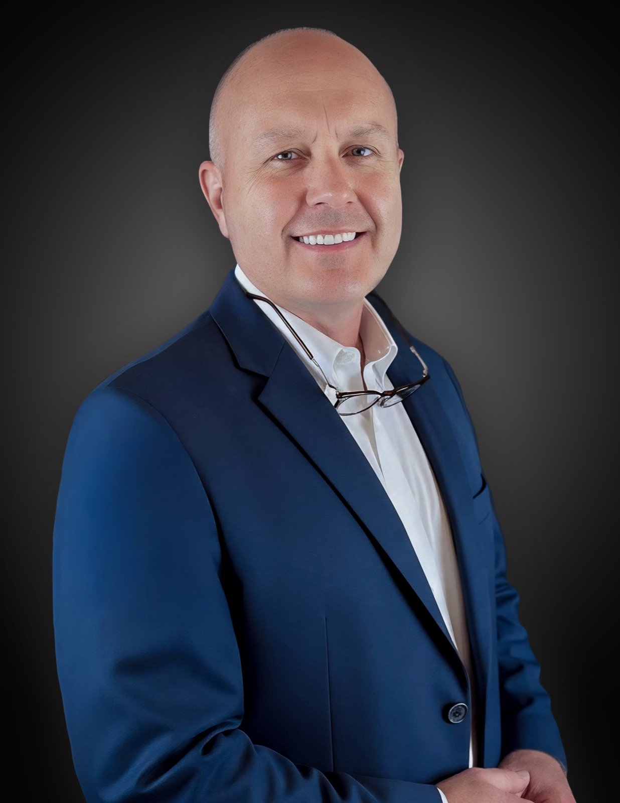 Richard Causey in a navy blazer, studio portrait