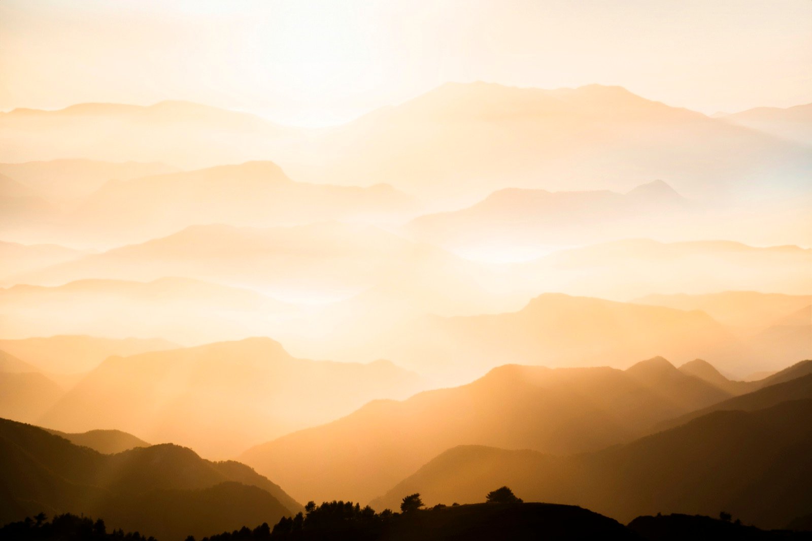 Layered ridgelines at sunrise